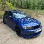 1M style Front Bumper for BMW E81 / E82 / E87 / E88, with PDC, with Washer holes, with fog lights